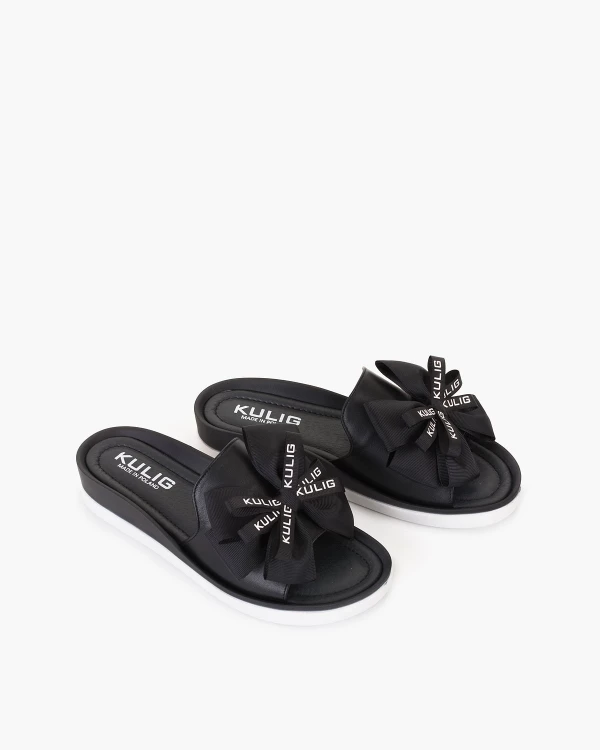 Czarne klapki skórzane z kokardą na koturnie